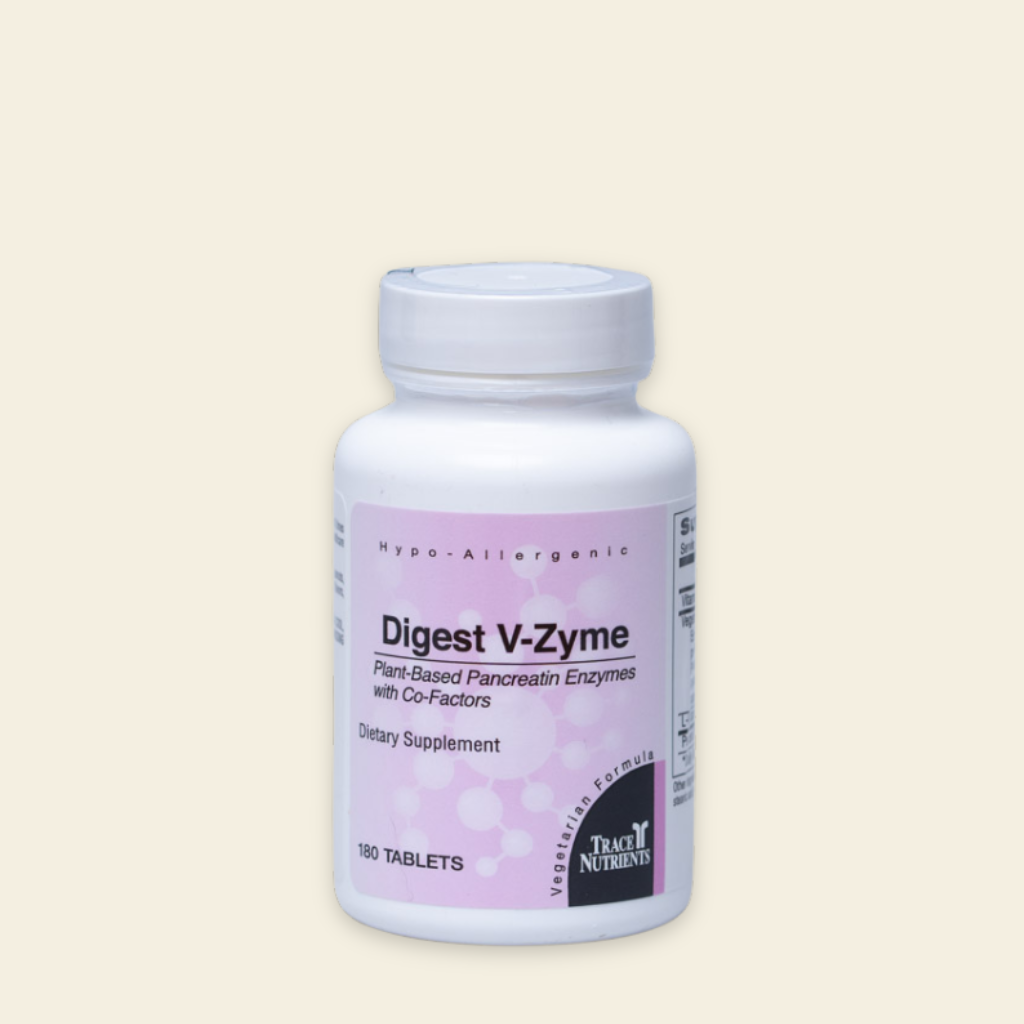 Supplement bottle labeled 'Digest V-Zyme' on a beige background