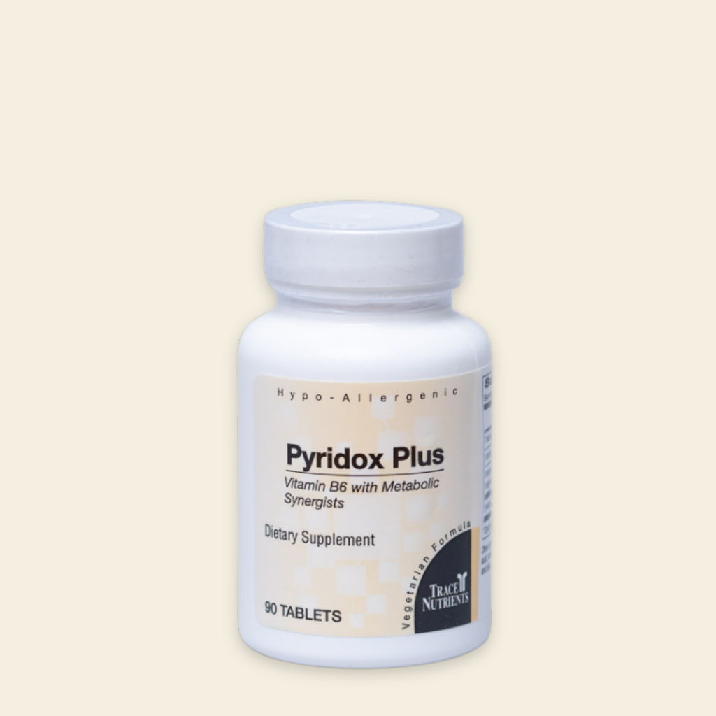 Supplement bottle labeled 'Pyridox Plus' on a beige background