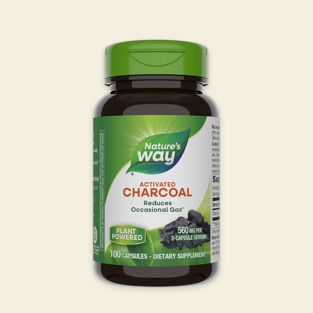 Nature's Way Activated Charcoal supplement bottle on a beige background