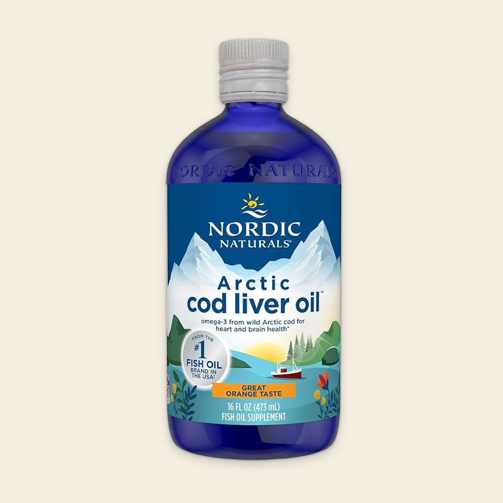 Bottle of Nordic Naturals Arctic cod liver oil on a beige background
