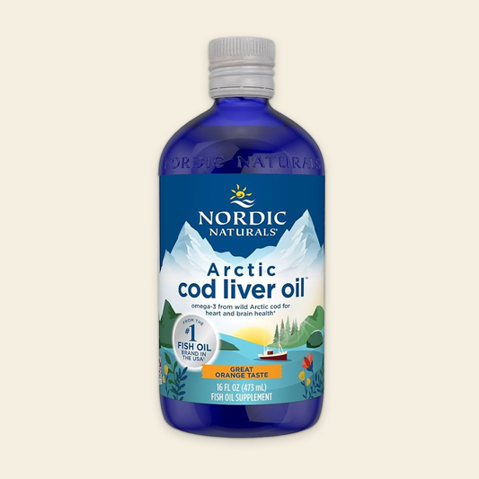 Bottle of Nordic Naturals Arctic cod liver oil on a beige background