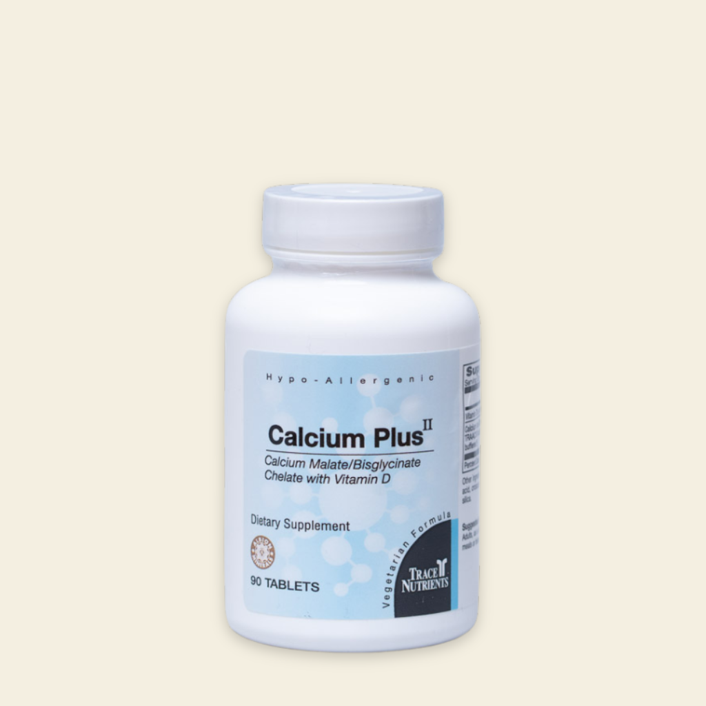 Supplement bottle labeled 'Calcium Plus II' on a beige background