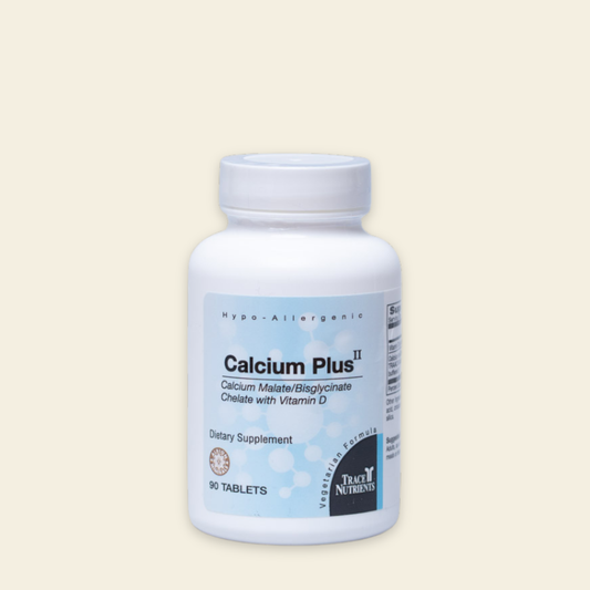 Supplement bottle labeled 'Calcium Plus II' on a beige background