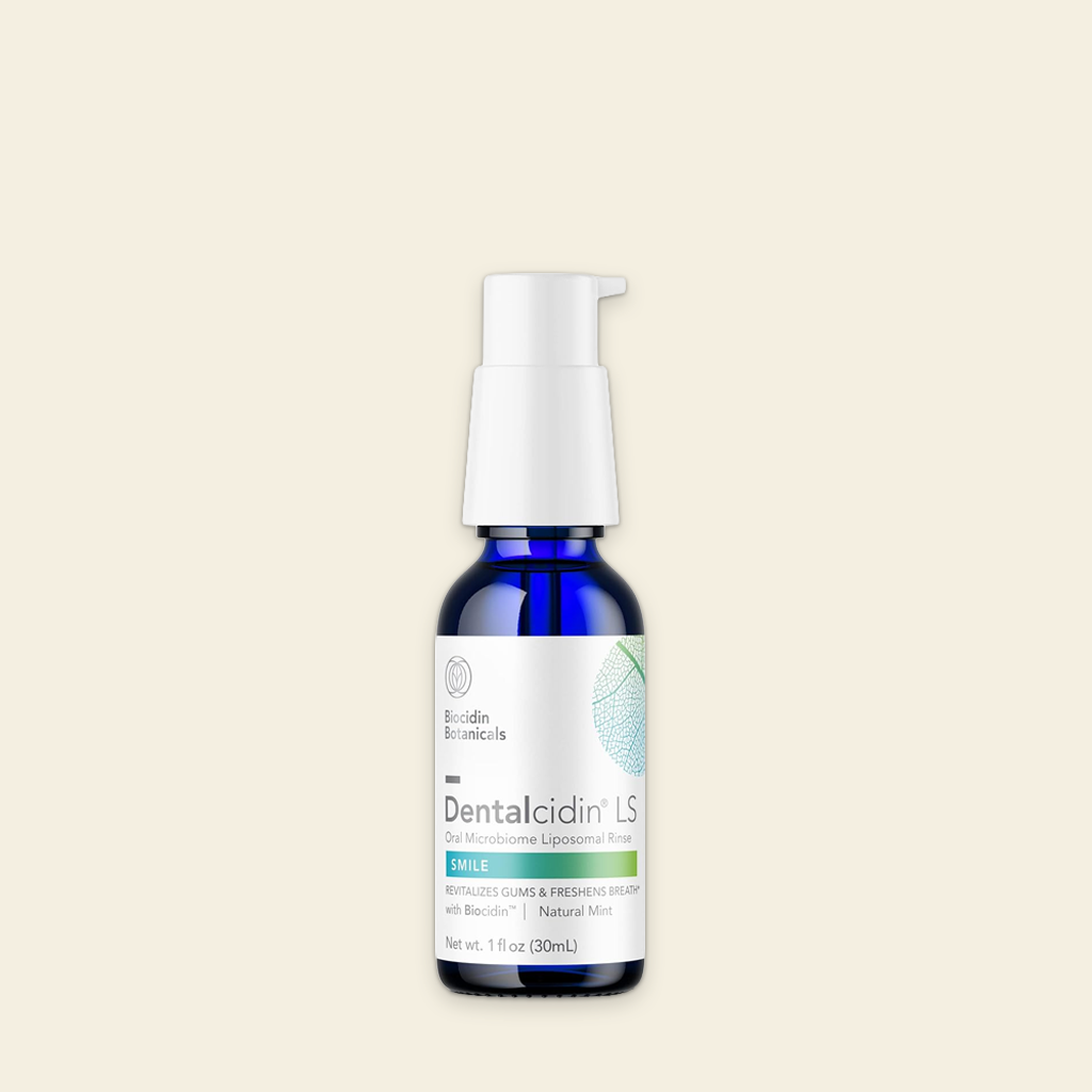 Bottle of Dentalcidin LS on a beige background