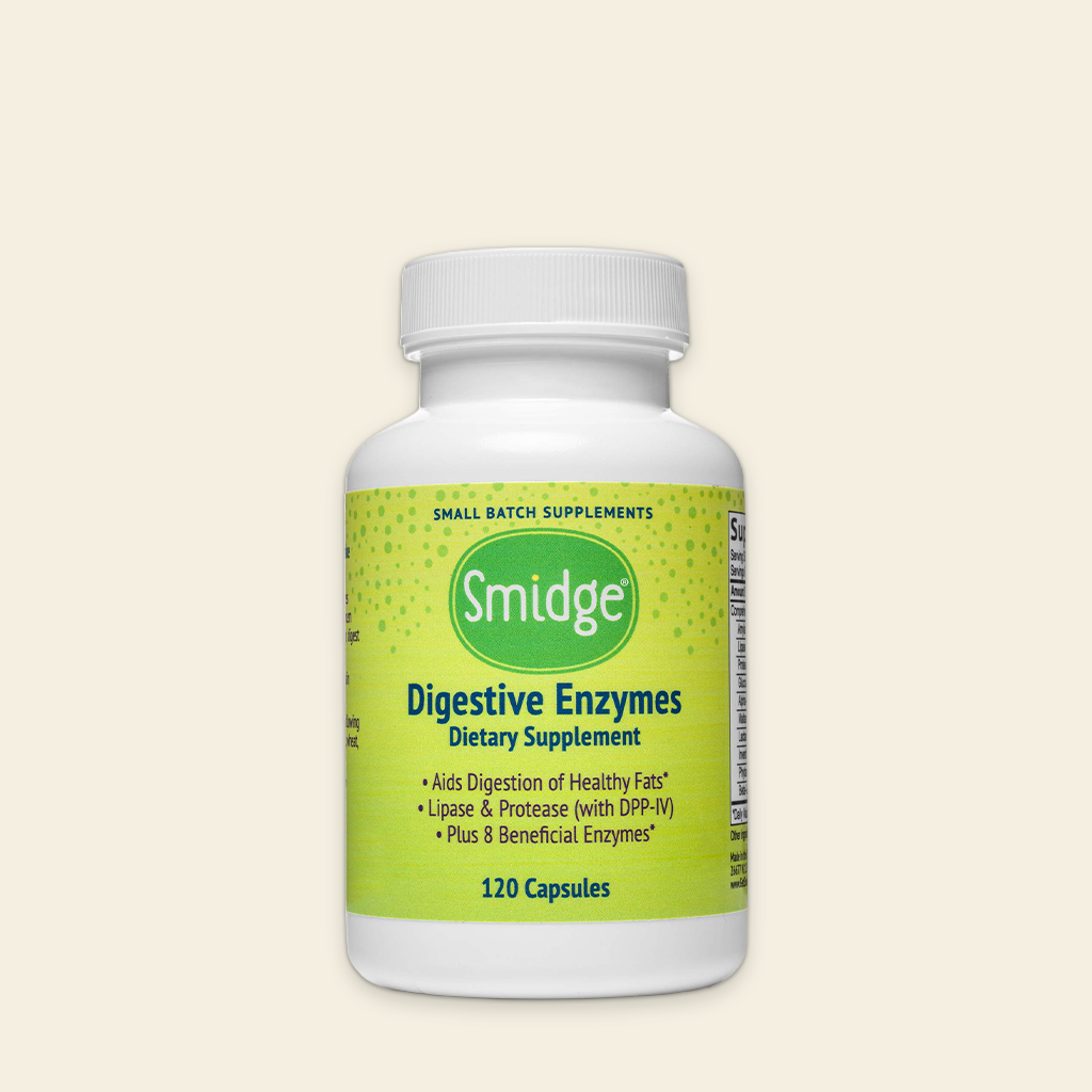 Bottle of Smidge Digestive Enzymes dietary supplement on a beige background