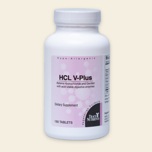 Supplement bottle labeled 'HCL V-Plus' on a beige background