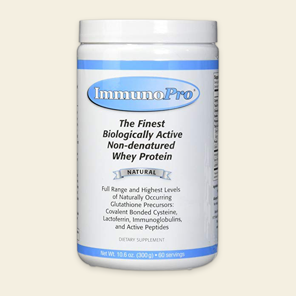 Container of Immunopro whey protein powder on a beige background