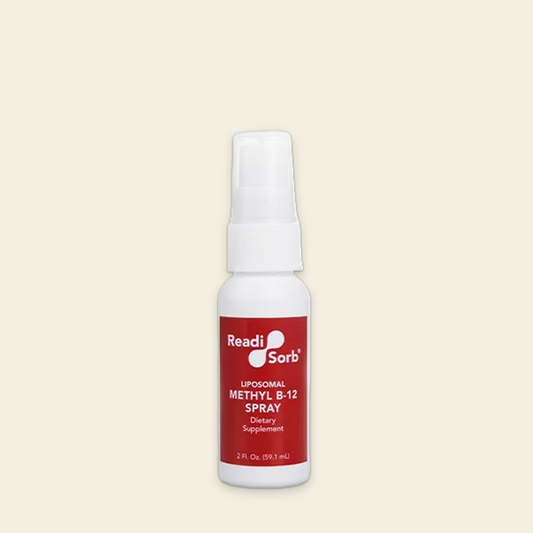 Bottle of Readi Sorb Liposomal Methyl B-12 Spray on a beige background