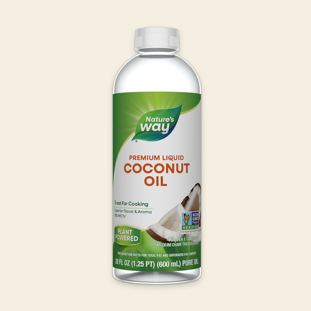 Bottle of Nature's Way Premium Liquid Coconut Oil on a beige background