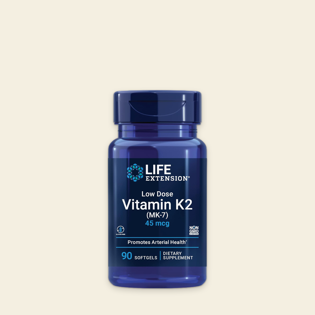 Blue bottle of Life Extension Vitamin K2 on a beige background