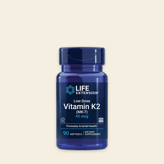 Blue bottle of Life Extension Vitamin K2 on a beige background