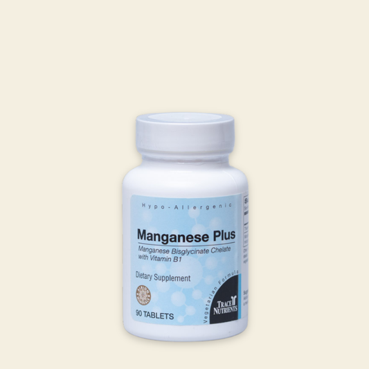 Supplement bottle labeled 'Manganese Plus' on a beige background