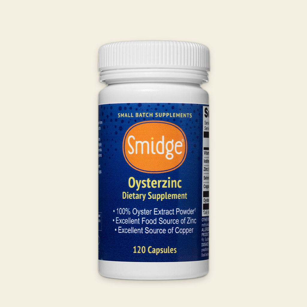 Supplement bottle labeled 'Smidge Oysterzinc' on a beige background