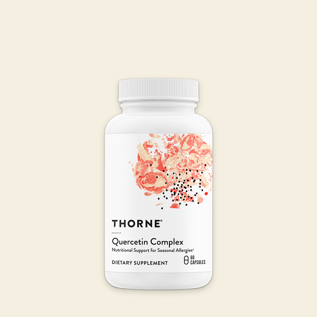 Thorne Quercetin Complex dietary supplement bottle on a beige background