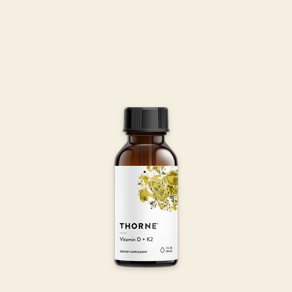 Thorne Vitamins bottle on a beige background