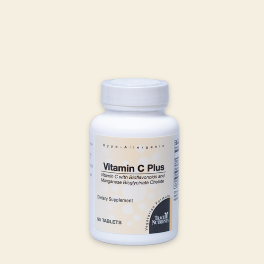 Vitamin C Plus supplement bottle on a beige background